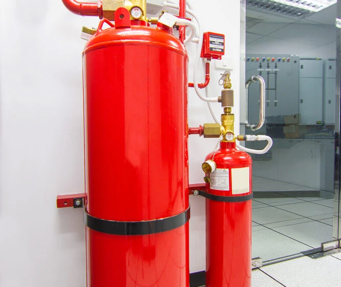 What is the difference between a water mist fire suppression system and a sprinkler system?