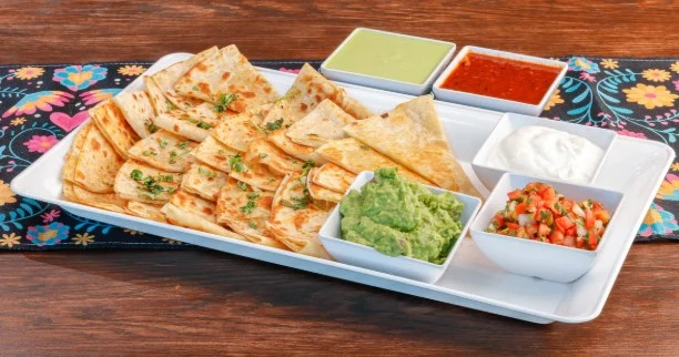 Graduation Party Goals: How To Book Catering In Fayetteville, AR That Fits Your Budget