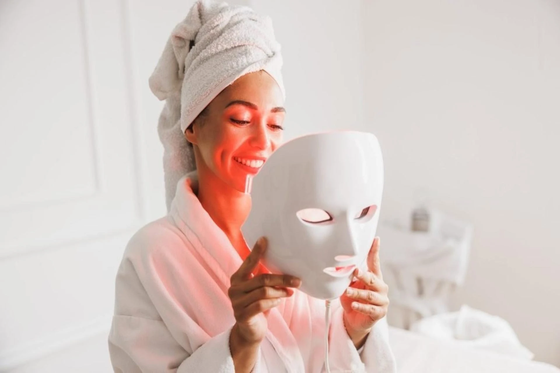 A woman preparing for red-light therapy.